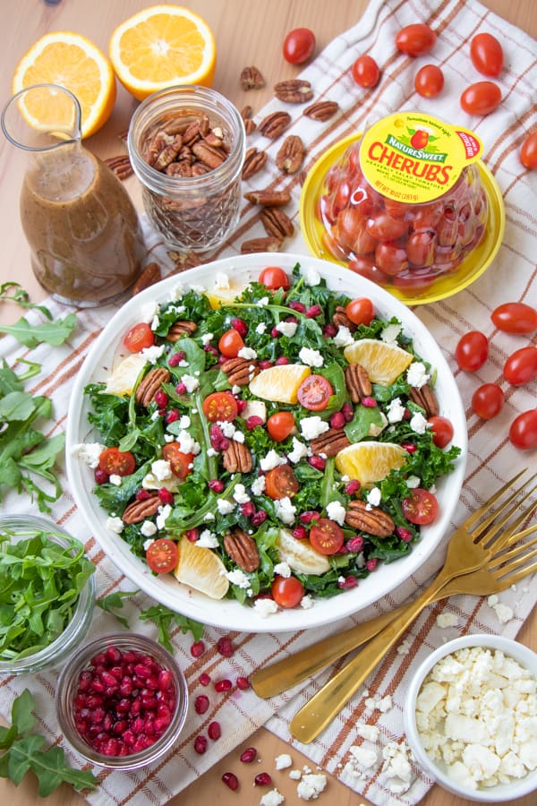 Ovehead picture of salad with ingredients surrounding the plate.