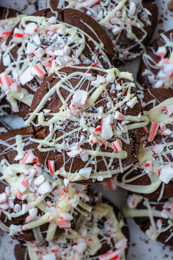 Close up of peppermint mocha cookie on a plate surrounded by more cookies.