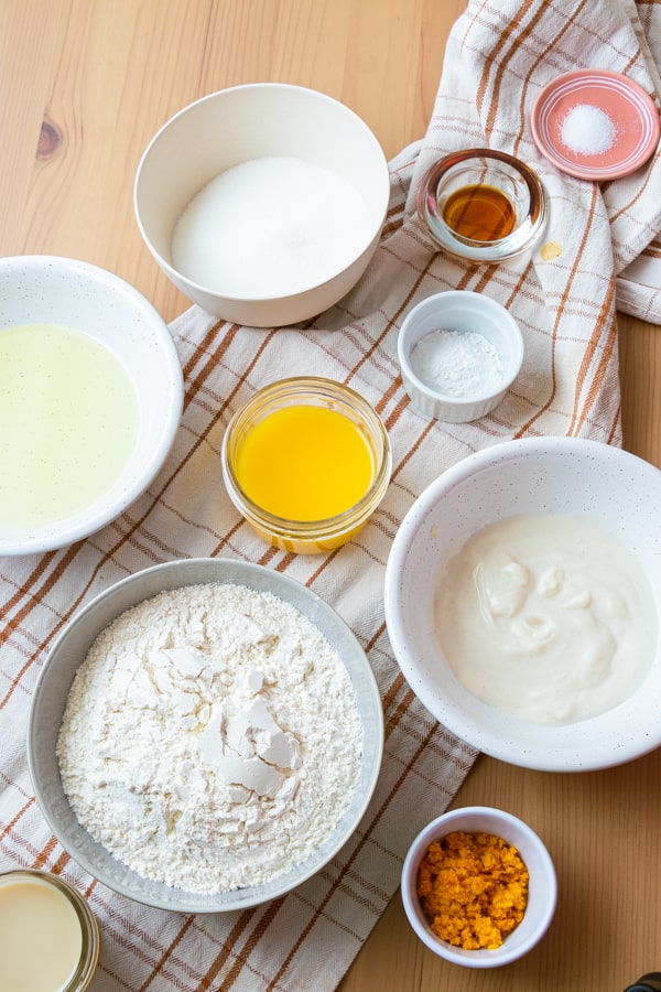 Ingredients for cake in bowls.