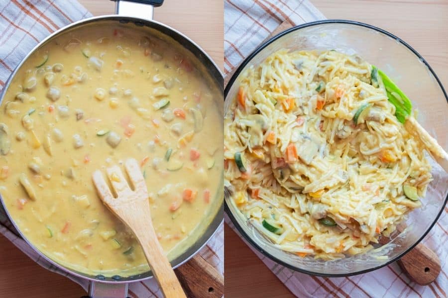 Cheesy sauce being mixed with potatoes.