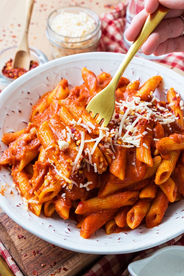 Fork taking a bite of pasta.