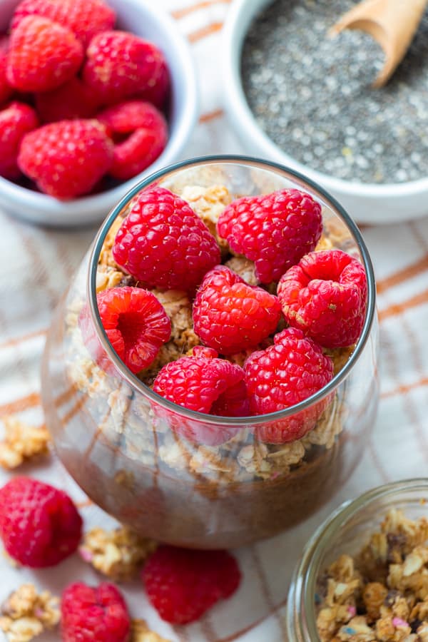 Pudding topped with raspberries.