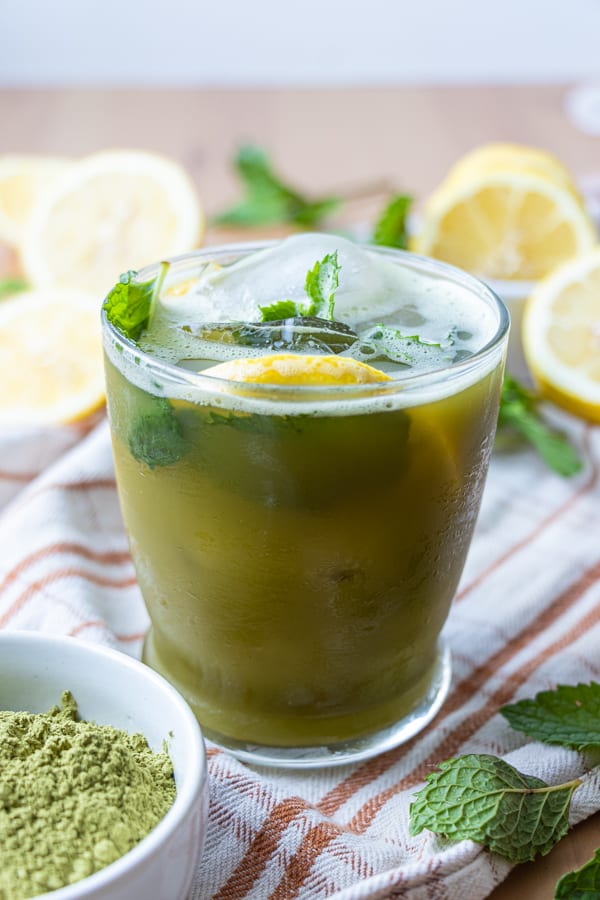 Lemonade with ice and lemon wedges.