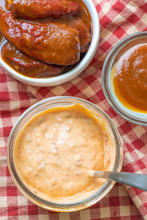 Sauce with peppers in bowls.