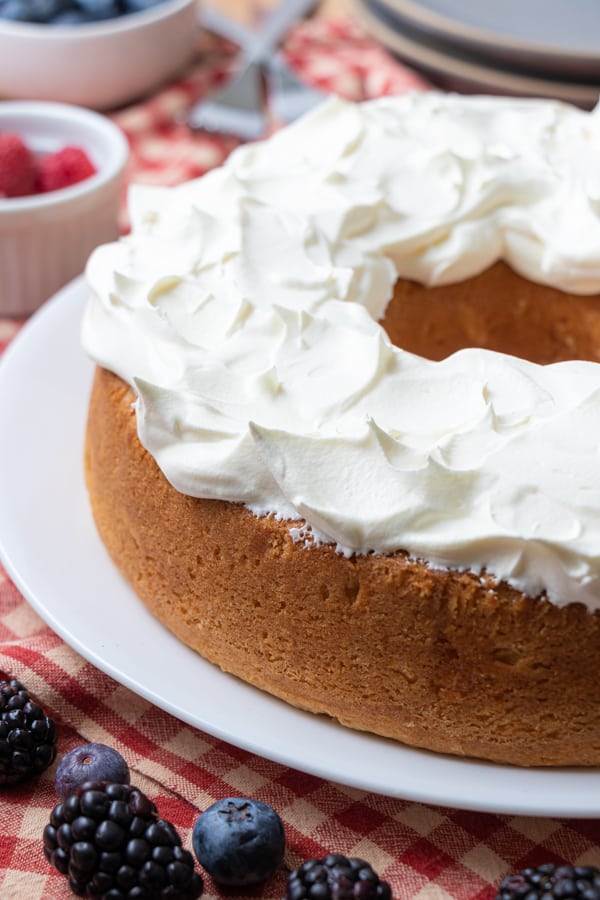 Angel food cake with whipped cream on top.