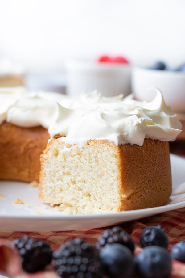 Baked vegan cake with whipped cream frosting.